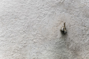 Old wall tap outdoors.