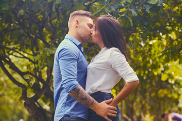 Attractive couple on a date in a city park.