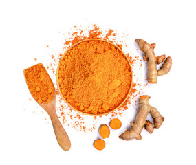 top view of turmeric roots and turmeric powder in wooden bowl isolated on white background
