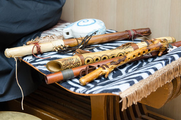 Wind musical instruments on the rug © Oleg