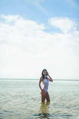 Beautiful girl is resting on the sea.