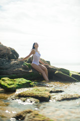Beautiful girl is resting on the sea.