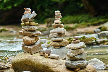 Fototapeta na wymiar Stones arranged zen-like by the river