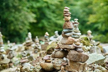 Fototapeta na wymiar Stones arranged zen-like by the river