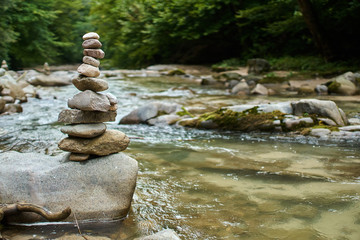 Stones arranged zen-like by the river