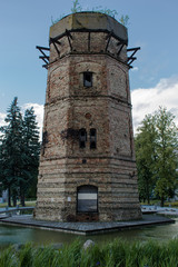 Fototapeta na wymiar Old tower, mill, on the park