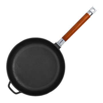 Empty cast iron frying pan isolated on white background closeup, top view