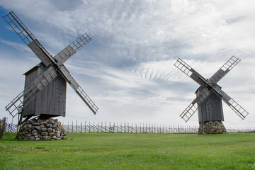Fototapeta na wymiar Two wooden old mill standing still
