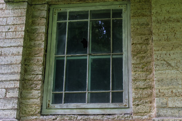 Broken window in abandoned building