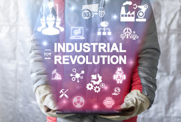 Industrial Revolution - Integrated Smart Innovative Information Technologies (IT). Industry 4.0 concept. Worker man offers tablet computer with industrial revolution text icon on virtual screen.