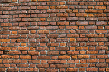 red brick wall texture grunge background with vignetted corners, may use to interior design