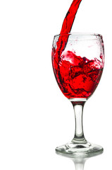 Red wine pouring on a glass isolated on white background. Clipping path