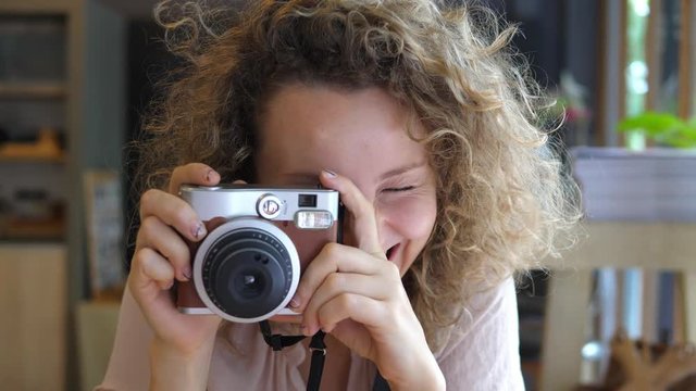 Young Happy Woman Photographing With Camera. 4K. Slow Motion. 