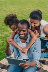 african american family with tablet