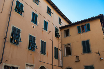 Exterior of typical Italian buildings in Lucca, Tuscany, Italy.