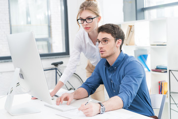 businesspeople working with computer