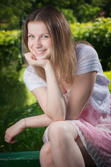Naklejka premium Portrait of the sitting girl
