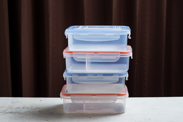 plastic box for food storage on the wooden