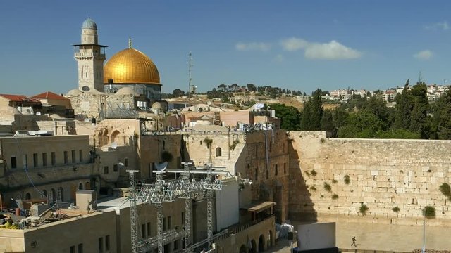 People crowd with soldiers and military men at the Western wall in Jerusalem. Western wall or Wailing wall or Kotel is the most sacred place for all jewish people.