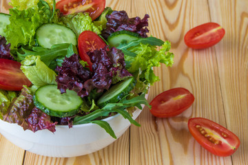 Fresh salad with mixed greens, cherry tomato and cucumber