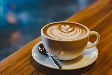 a cup of hot coffee (selective focus for mood and tone)