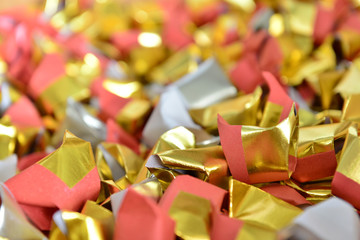 joss paper gold and silver paper for worship with Joss Paper Chinese Tradition. Gold Paper folded for passed away ancestor's spirits for chinese ceremony.