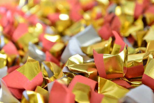 joss paper gold and silver paper for worship with Joss Paper Chinese Tradition. Gold Paper folded for passed away ancestor's spirits for chinese ceremony.