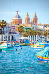 Luzzu anchored in Malta, at the port of Marsaxlokk - obrazy, fototapety, plakaty