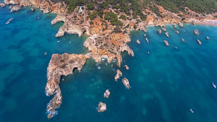 Aerial. View from the sky of coast of Portimao. Beaches Submarino, and praia Joao de Arens.