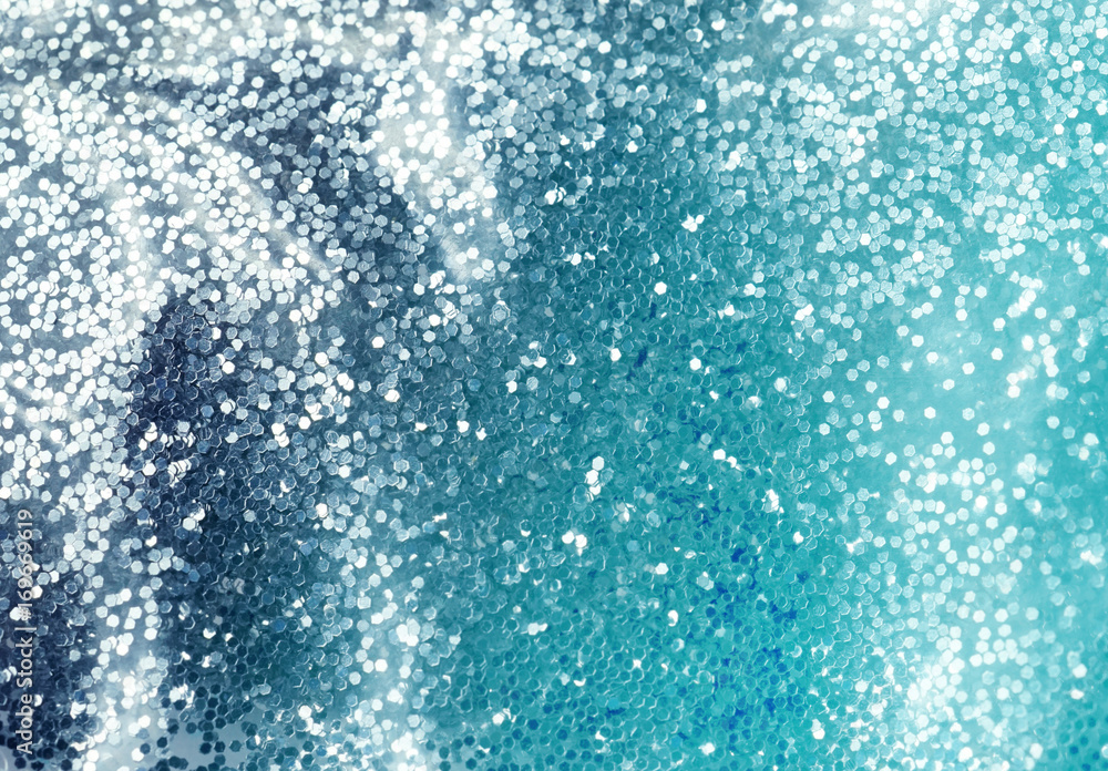 Poster glamorous festive luxury background with blue glistening shimmering sparkles. sequins texture close-