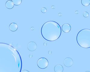 Soap bubbles with reflections on a blue background
