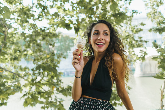 Cheerful traveler with ice cream cone