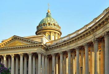The dome and colonnade of the Kazan Cathedral lit by the sun against the sky