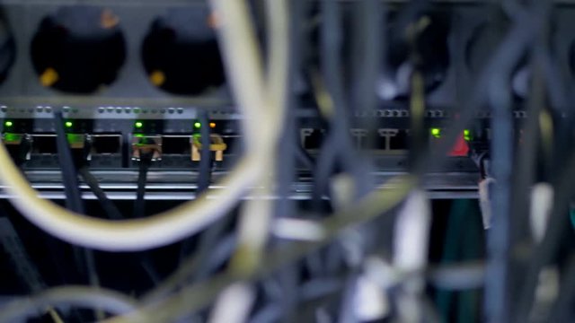 Data storage cabinet with many cables.