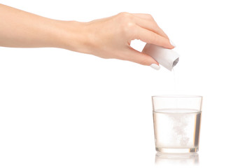 Female hand holding glass of water powder medicine