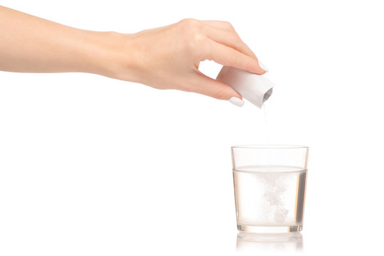 Female Hand Holding Glass Of Water Powder Medicine