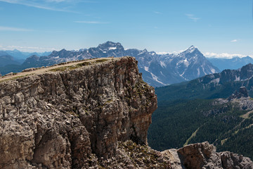 Mountain Ridge with Big Stone among Barren Mountains in Italian Dolomites Alps in Summer Time