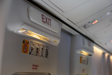 Emergency Exit and Light in Aircraft Cabin