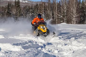 Athlete on a snowmobile