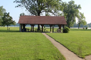 The picnic shelter in the park and near the lake.