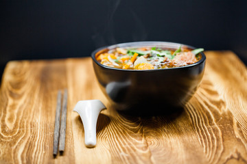 Rich flavor beef stew in the bowl on wooden table 