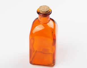 Glass jar of orange color on white background. Isolated. Container.