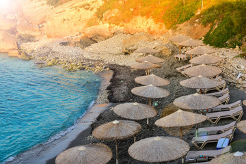 Fototapeta premium Beach umbrellas on the island of Crete.