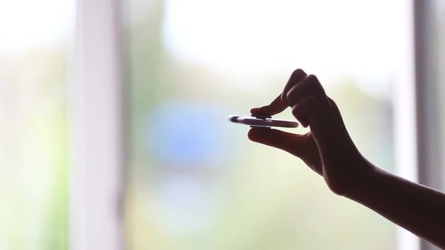 Hand spinner, or fidgeting spinner, rotating on child's hand