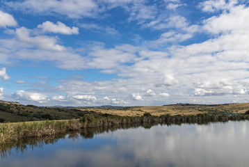 Lake Reflecting Blue Cloudy Sky Landscape in South Africa