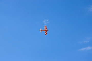 Fototapeta na wymiar A homemade plane flies in the sky