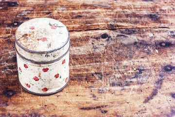 Vintage metal box on wooden table