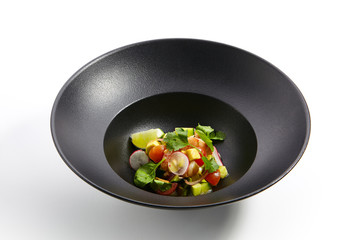Special dishes of Pan-Asian cuisine in dark iron plate