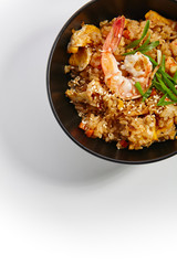 Special dishes of Pan-Asian cuisine in dark iron plate