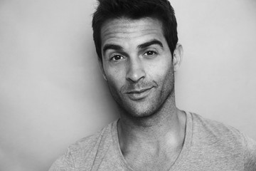 Handsome dude in black and white portrait, studio